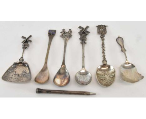 A Dutch 835 grade silver teaspoon, the handle modelled as a windmill, an 835 grade silver propelling pencil, a white metal sh