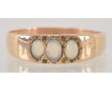 A yellow metal opal set ring, size O/P, approx 2g.