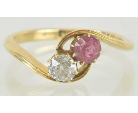 An 18ct gold diamond and pink stone crossover ring, size M, approx 2.7g.