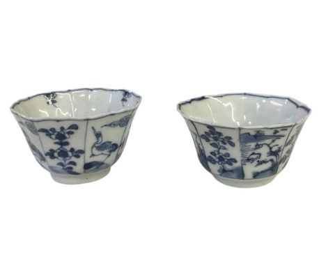 A pair of 19th century Chinese blue and white porcelain tea bowls, with alternate panels decorated with birds and foliage, an