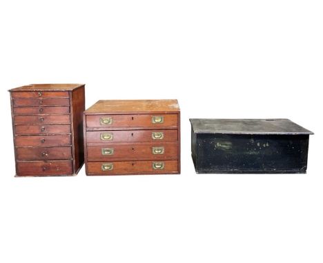 An early 20th century mahogany tabletop collector's cabinet of four long drawers, each drawer with dividing sections, campaig