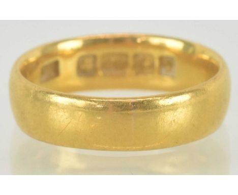A 22ct gold band ring, size J, approx 4.5g.