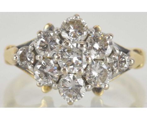 An 18ct yellow gold diamond lozenge shaped ring, set with nine round brilliant cut diamonds totalling approx 1ct, size I, app