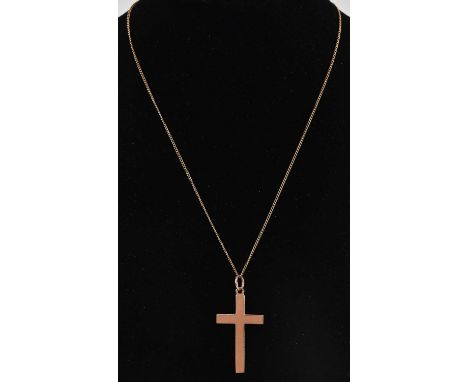 A 9ct yellow gold cross pendant, 4 x 2.1cm, suspended on a 9ct yellow gold fine link necklace, length approx 44cm, combined a