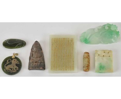 Seven Chinese carved jade pendants, including a rectangular example with gilt heightened character decoration, 6 x 4.2cm, a f
