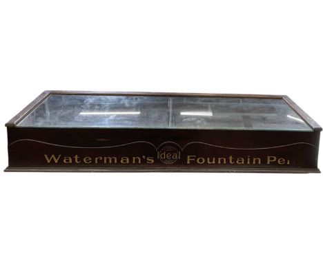 An early 20th century 1920s advertising tabletop display cabinet, 'Waterman's Ideal Fountain Pen', with glazed top and an arr