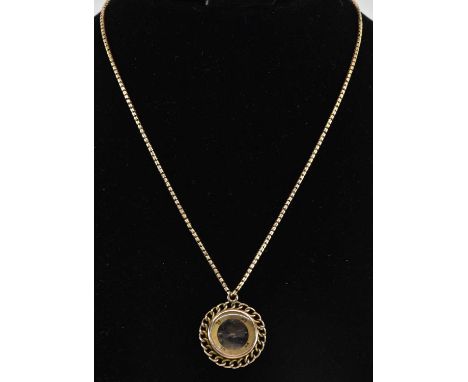A 9ct yellow gold mounted compass pendant, suspended on a yellow metal fine link necklace, length approx 40cm, combined appro