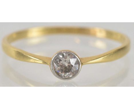 An 18ct gold diamond solitaire ring, the bezel set diamond approx 0.3ct, on an 18ct gold shank, size T, approx 1.5g.