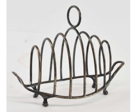WILLIAM HUTTON &amp; SONS LTD; a late Victorian hallmarked silver toast rack, London 1897, height 11cm, width 17cm, approx 4.