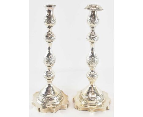MOSHE RUBIN; a pair of George V hallmarked silver candlesticks, one with Hebrew inscription and the other inscribed with 'Pre