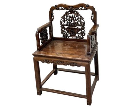 A 19th century Chinese carved Huang Huali elbow chair, with well detailed carved back and arms decorated with foliage and fru