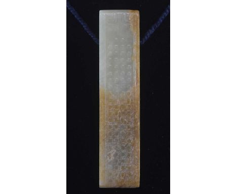 A Chinese jade archaic belt hook, with russet inclusions and simple carved decoration, length 9cm.