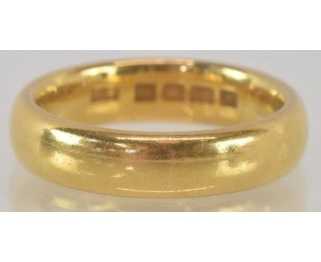 A 22ct yellow gold wedding band, size K, approx weight 7.6g.