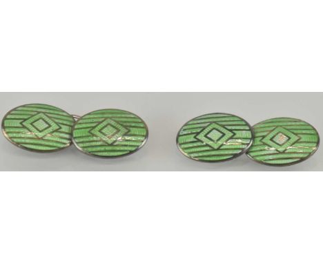 CHARLES HORNER; a pair of sterling silver Art Deco cufflinks, with green enamelled oval fronts and diamond shaped centres, un