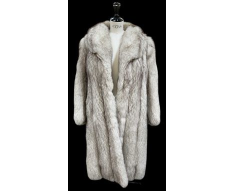 A vintage full length silver fox fur coat.