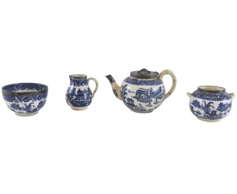 ROYAL WORCESTER; a Victorian hallmarked silver mounted blue and white four piece tea service, decorated in the 'Blue Willow' 