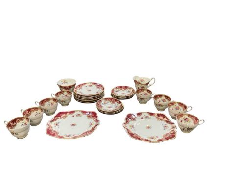 PARAGON; an eight setting tea service, decorated in the 'Honiton' pattern, comprising eight saucers, eight tea cups, eight si