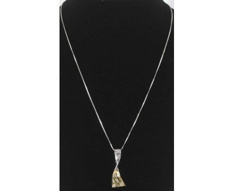 An 18ct white gold pendant, set with assorted shaped diamonds, on 9ct white gold chain, length of chain approx 46.5cm, combin