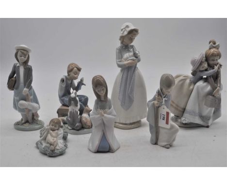 A collection of six Lladro porcelain figures, largest 20cm high, together with a Nao porcelain figure