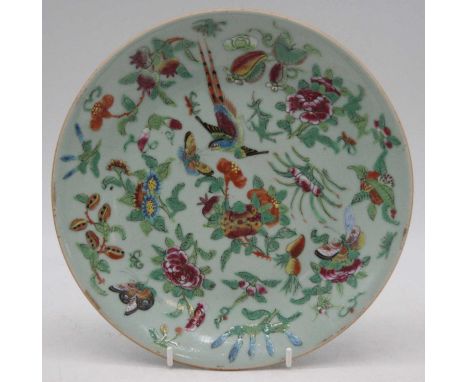 A 19th century Chinese Canton export plate, on a celadon ground, enamel decorated with exotic birds, butterflies and foliage,