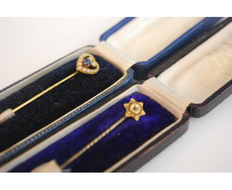 Circa 1910, yellow metal seed pearl and sapphire (probably synthetic) heart shaped tie pin in fitted case, together with one 