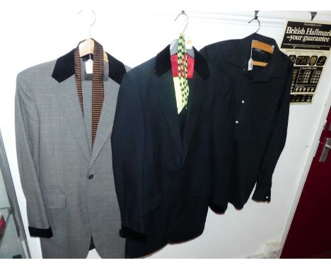 A 1960s style "teddy boy" suit, the single breasted dark blue jacket with felt collar and cuffs with single chest pocket, two