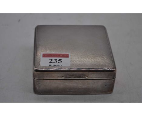 An Elizabeth II silver clad table cigarette box of square shape having engine turned lid and cedar lined interior, 8.5x8.5cm