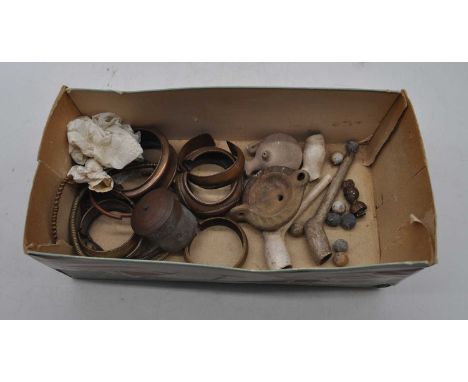 A collection of miscellaneous items to include a Greco-Roman style pottery oil lamp, various copper bangles, copper betel nut