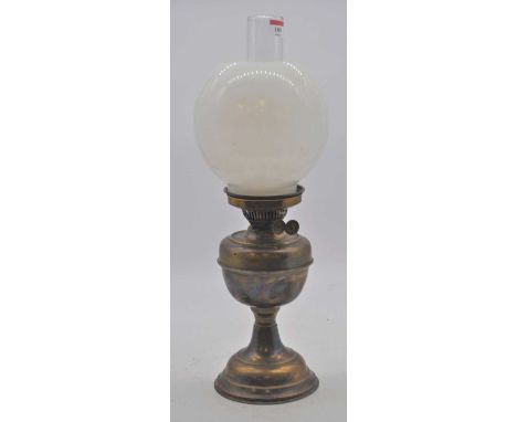 A Victorian brass oil lamp, having a milk glass shade, height 53cm overall