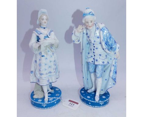 A pair of late 19th century French Vion &amp; Baury porcelain figures, the lady in standing pose holding a teaset on tray, th