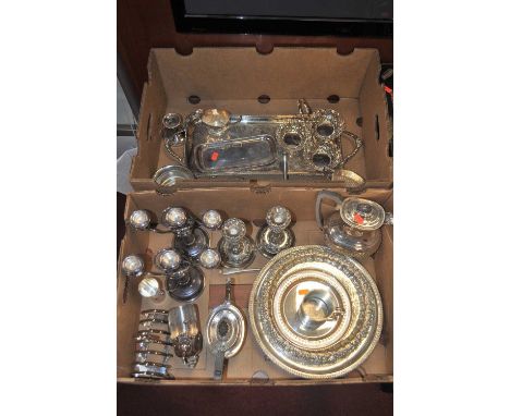 Two boxes of miscellaneous metalware to include silver plated drinks tray, silver plated table candle sticks, three piece bac