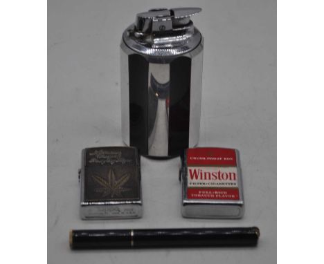 A Ronson Art Deco style chromed table lighter, together with two Zippo style pocket cigarette lighters, and one other novelty