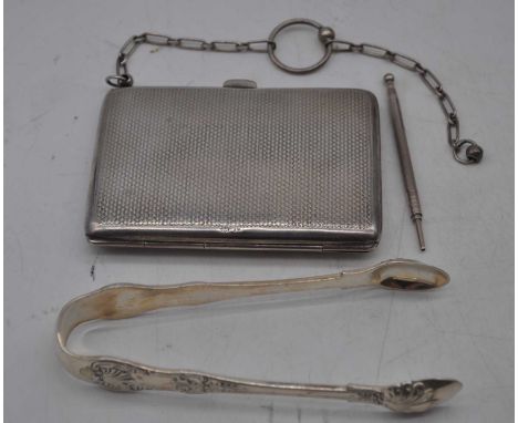 A George V ladies silver purse of hinged rectangular form having engine turned decoration and leather lined interior, togethe