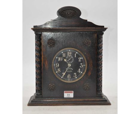 An early 20th century oak cased Ingersoll Revally radio light mantel clock, the dial showing Arabic numerals with subsidiary 