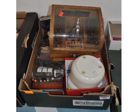 A collection of watchmaker's parts and tools to include a glazed oak case marked NKS standard with further labels Standard Ty