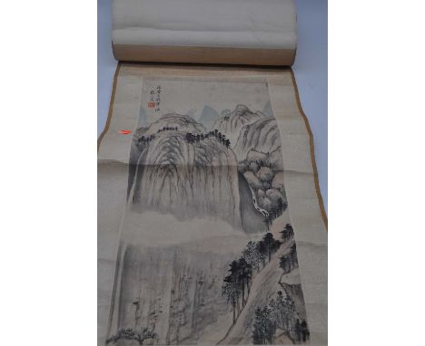 A Chinese wall hanging scroll depicting a mountain landscape