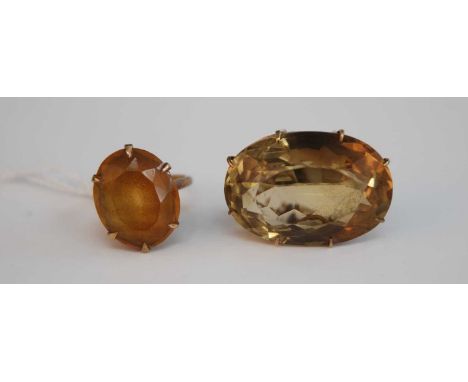 A 9ct gold topaz set dress ring, 5g, size K/L, together with a yellow metal and smoky quartz set brooch, stamped 9ct with saf