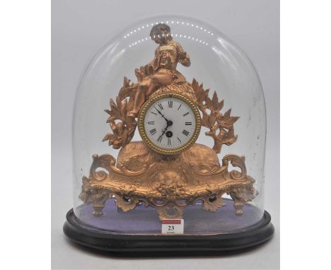 A 19th century French gilt metal figural mantel clock, the enamel dial showing Roman numerals, housed under a glass dome, hei