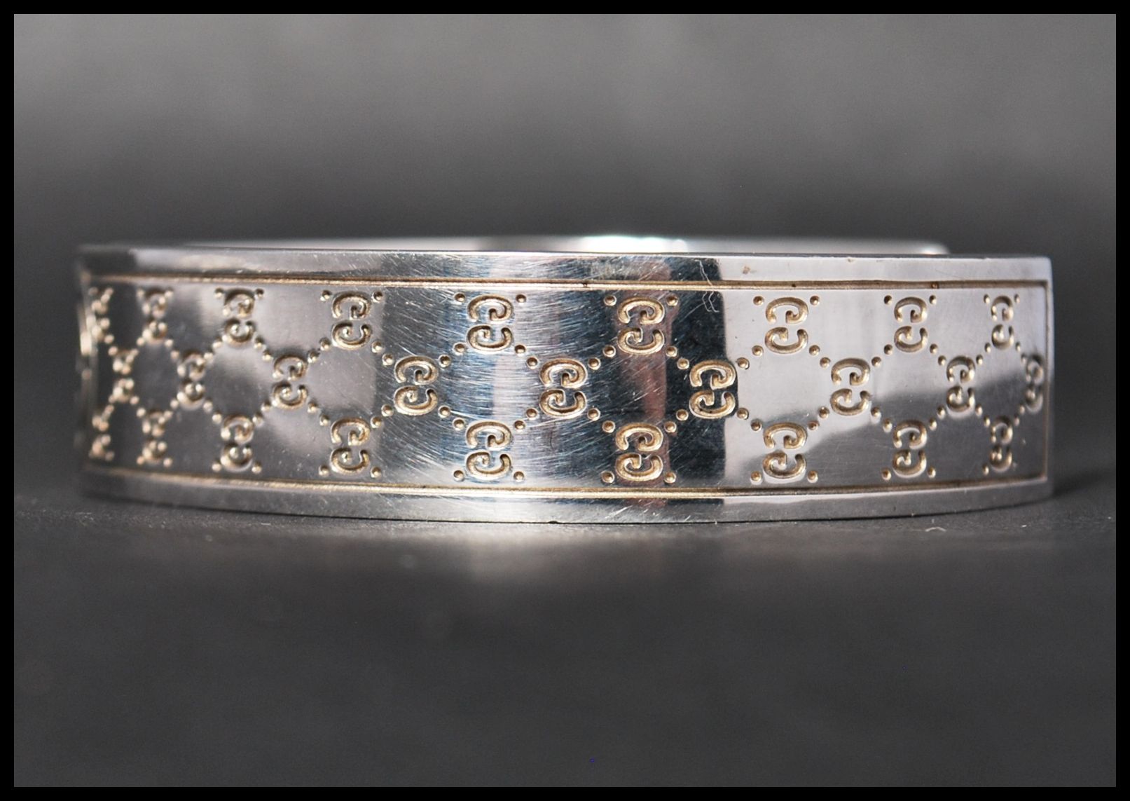 A hallmarked 925 silver designer Gucci cuff bangle bracelet . Marked