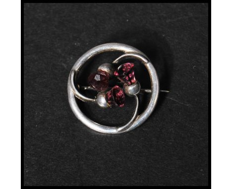 A hallmarked Art Nouveau Charles Horner silver brooch in a Scottish thistle design with amethyst flower heads and C Clasp. Ha