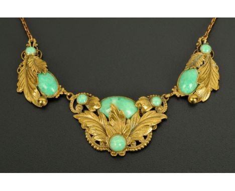 A green jade necklace, in gold plated leaf mount.  