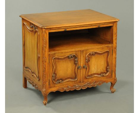 A French walnut bedside cabinet, with slide, open shelf and pair of cupboard doors beneath and raised on short cabriole legs.