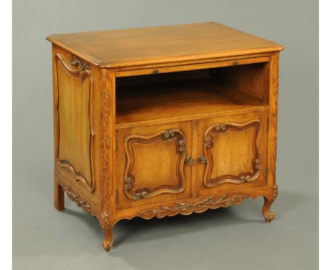 A French walnut bedside cabinet, with slide, open shelf and pair of cupboard doors beneath and raised on short cabriole legs.