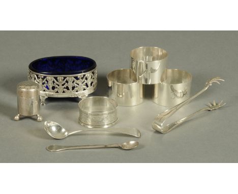 A silver salt, stamped "925", pierced and with blue glass liner, and three similar serviette rings, serviette ring, pair of s