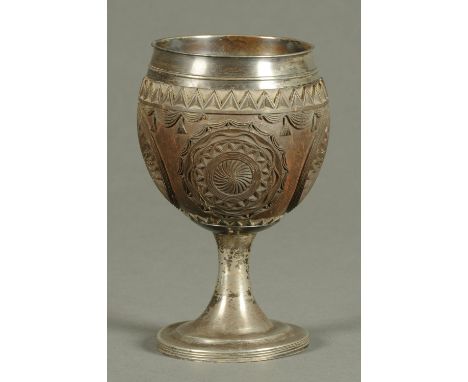A Georgian silver mounted coconut cup, with silver interior and stem, hallmark probably London 1807, maker Phipps & Robinson.