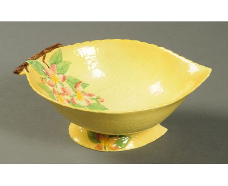 A Carltonware leaf moulded bowl, yellow ground with dog roses.  Length 28 cm. 
