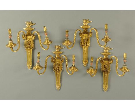 A set of four Edwardian brass two branch Adam style wall light fittings.  Height 35 cm, width 31 cm.  