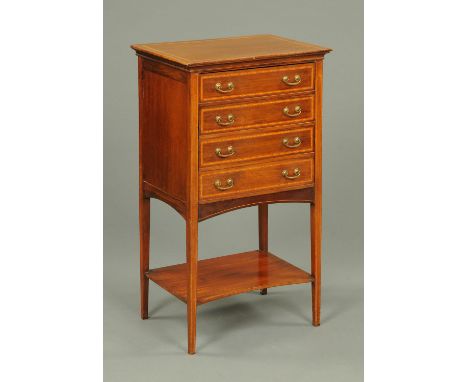 An Edwardian inlaid mahogany music cabinet, with four drawers with brass drop handles and raised on tapered legs of square se