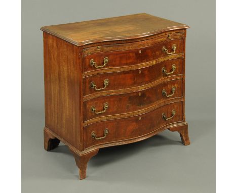An Edwardian mahogany serpentine fronted chest of drawers, with slide above four graduated drawers with brass drop handles, w