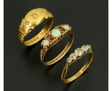 Three gold rings, 18 ct with small diamond chips to starburst, Chester hallmark, size N, 9 ct opal and garnet, size M, and 18